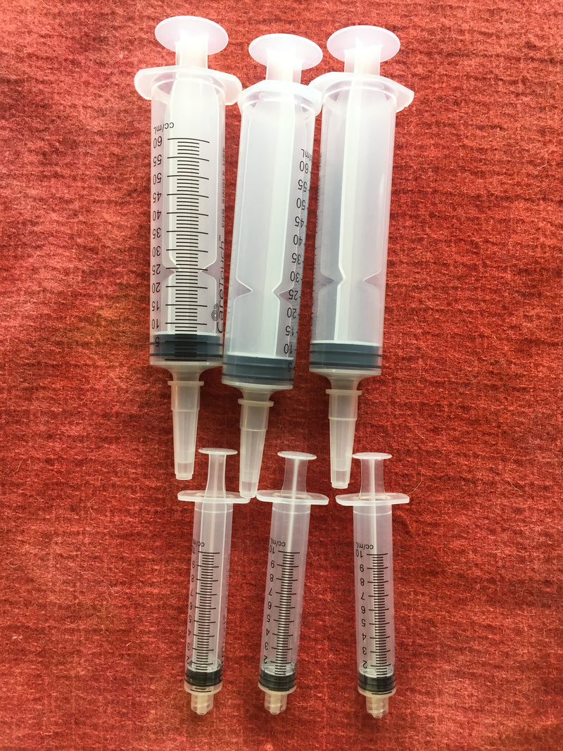 Dye syringes